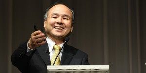 Chairman of Japanese mobile carrier SoftBank, Masayoshi Son, gestures during a press conference announcing the company's earnings in Tokyo on November 4, 2014. SoftBank said net profit in the first six months of its fiscal year jumped by more than a third, thanks to a five-billion-USD gain from its stake in Chinese e-commerce giant Alibaba. AFP PHOTO / TOSHIFUMI KITAMURA (Photo credit should read TOSHIFUMI KITAMURA/AFP/Getty Images)